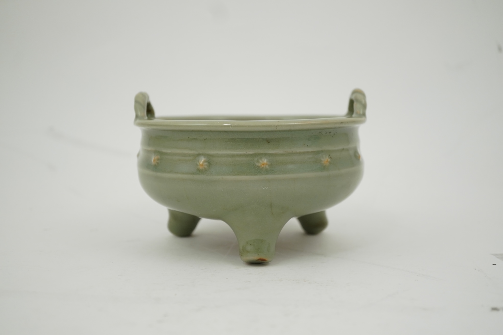 A Chinese Longquan celadon crackle glazed tripod censer, Ming dynasty or later